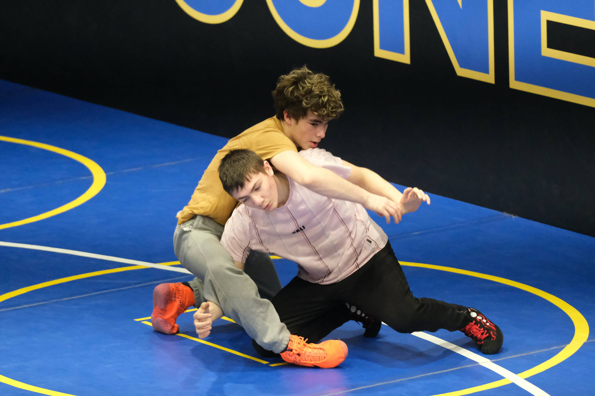 Juneau-Douglas High School: Yadaa.at Kalé sophomores Felix Hesson and Camden Messmer work on a technique Monday during a three-day wrestling clinic at the Juneau Wrestling Center led by Askren Wrestling Academy coach Wilder Wichman. (Klas Stolpe / Juneau Empire)