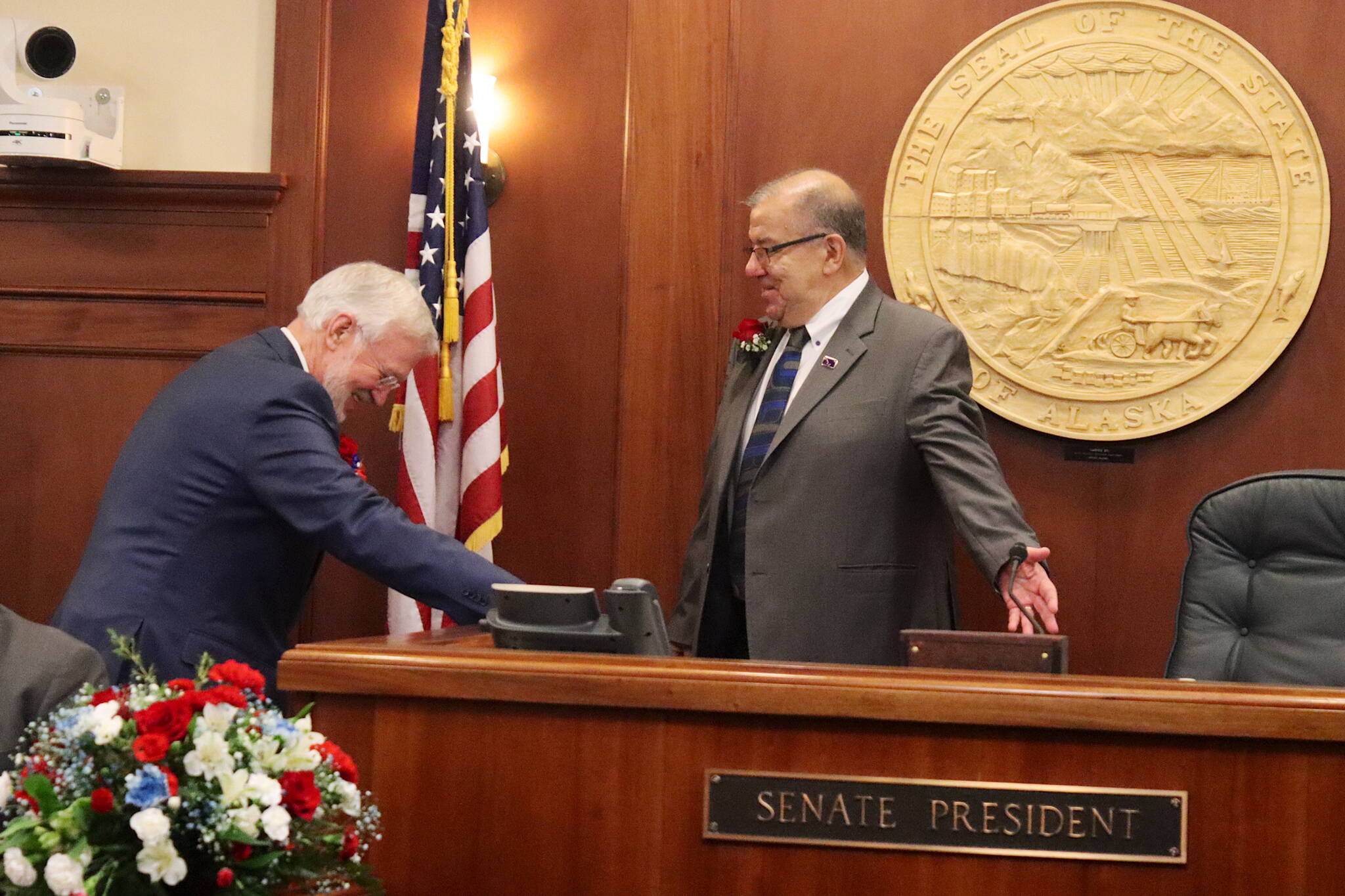 Sen. Lyman Hoffman (D-Bethel) invites Sen. Gary Stevens (R-Kodiak) to take the presiding chair after being unanimously elected Senate President during the opening day of the 34th Alaska State Legislature on Tuesday. (Mark Sabbatini / Juneau Empire)