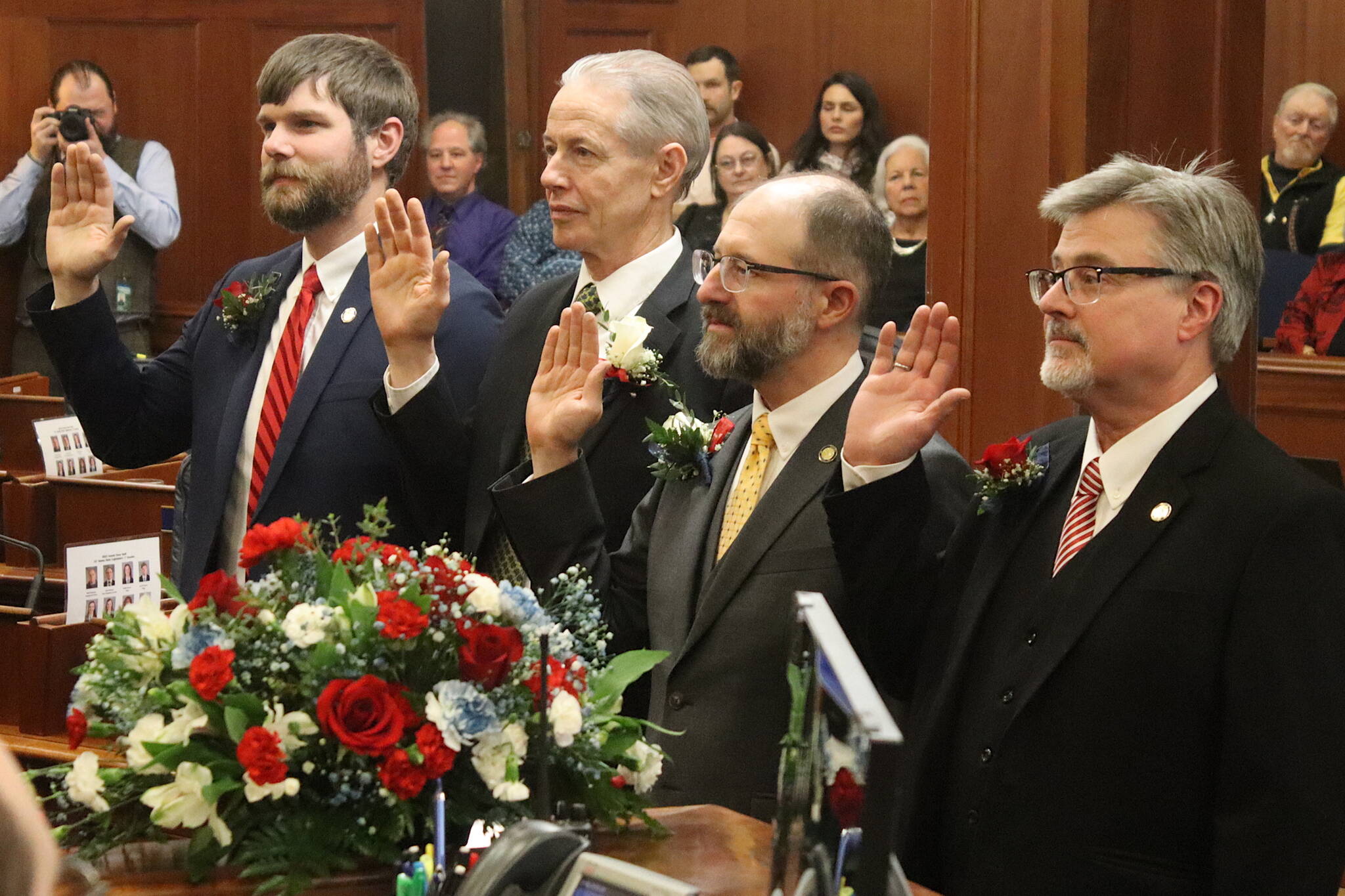 State Sens. Jesse Bjorkman (R-Nikiski), Matt Claman (D-Anchorage), Jesse Kiehl (D-Juneau) and Sen. James Kaufman (R-Anchorage) are sworn in by Lt. Gov. Nancy Dahlstrom during the opening day of the 34th Alaska State Legislature on Tuesday at the Alaska State Capitol. (Mark Sabbatini / Juneau Empire)