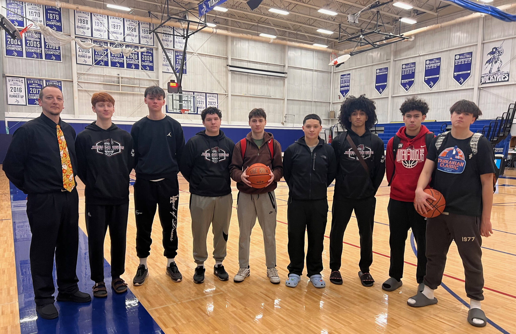 The Juneau-Douglas High School: Yadaa.at Kalé Crimson Bears boys junior varsity basketball team pose for a photo Saturday in the Petersburg High School gym. (Photo courtesy JDHS JV)