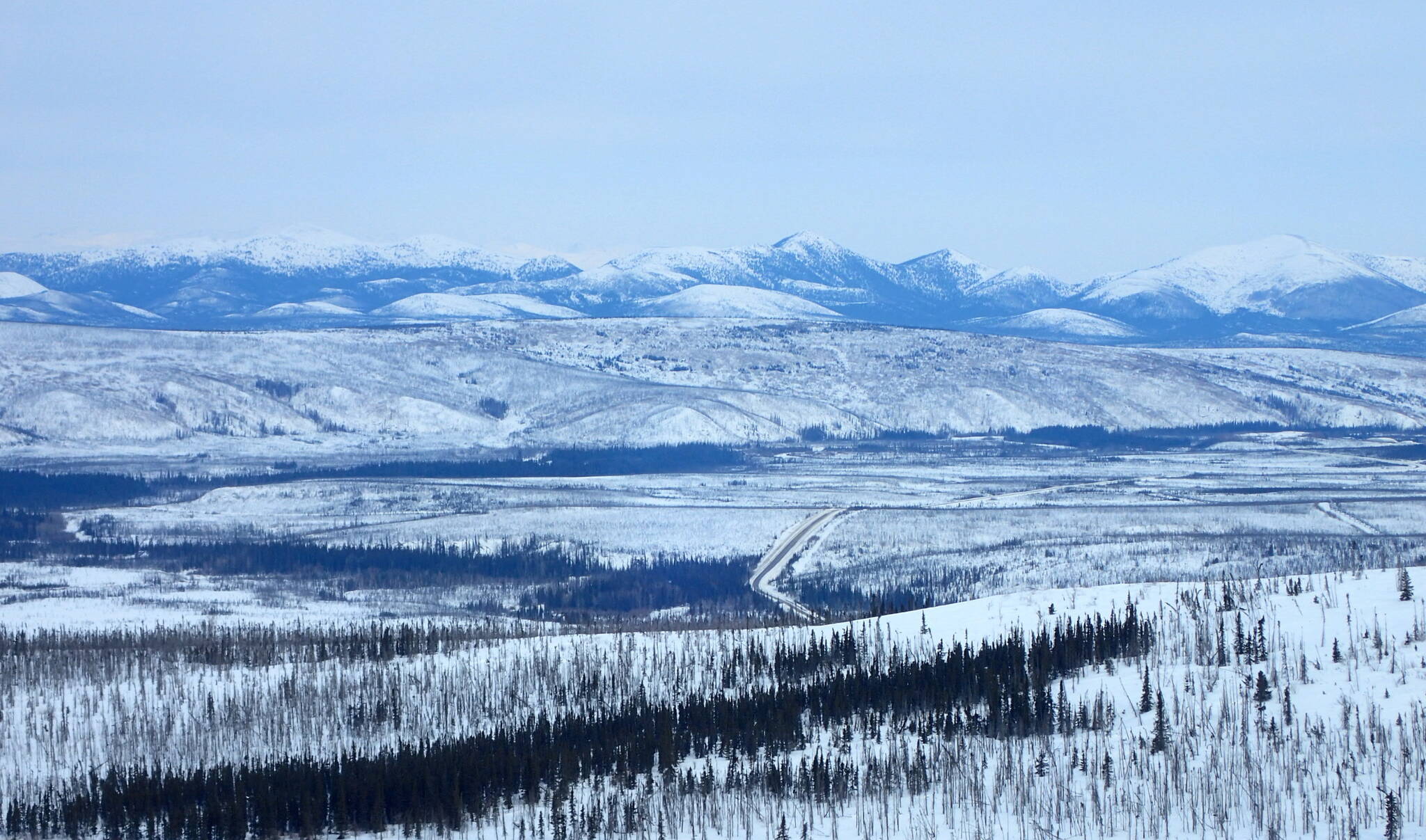 The Dalton Highway winds through the Jim River and Prospect Creek valleys in northern Alaska, where an official thermometer registered Alaska’s all-time low of minus 80 degrees F on Jan. 23, 1971. (Photo by Ned Rozell)