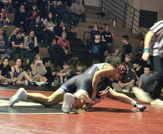 Thunder Mountain Middle School seventh grader Ngai Kivalu grapples during the Stikine Wrestling Championships on Saturday in Wrangell. (Photo courtesy TMMS)