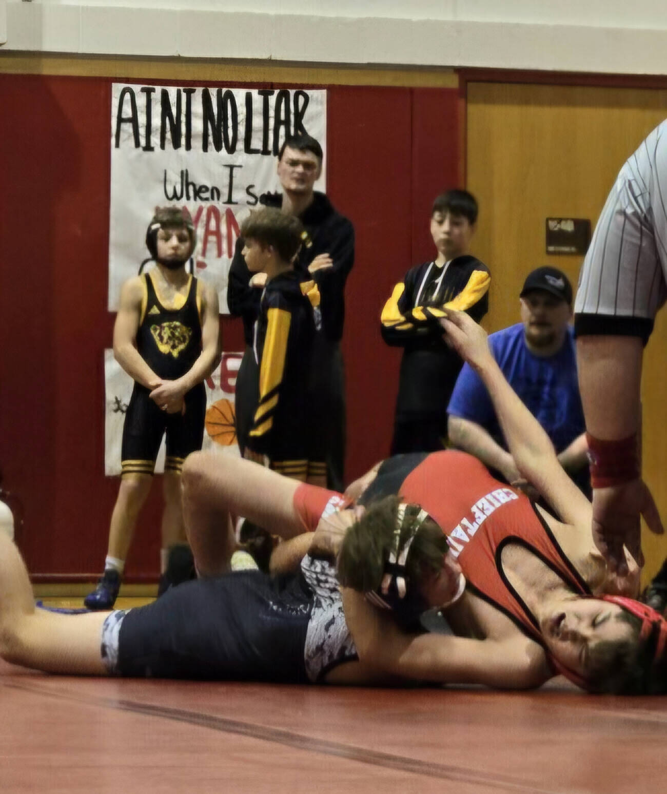 Thunder Mountain Middle School seventh grader Andrew Erickson pins an opponent from Klawock during the Stikine Wrestling Championships last weekend in Wrangell. (Photo courtesy TMMS)