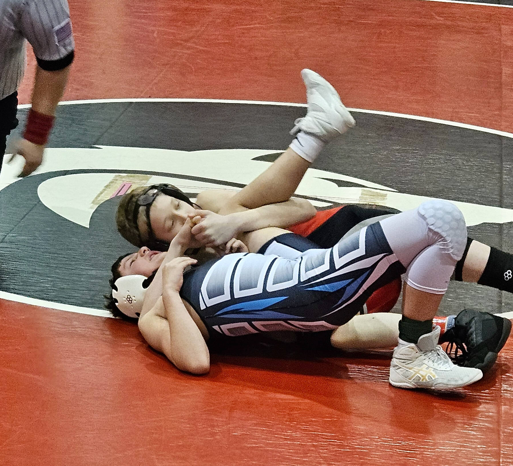 Thunder Mountain Middle School eighth grader Jayden Frickey cradles an opponent from Ketchikan during the Stikine Wrestling Championships last weekend in Wrangell. (Photo courtesy TMMS)