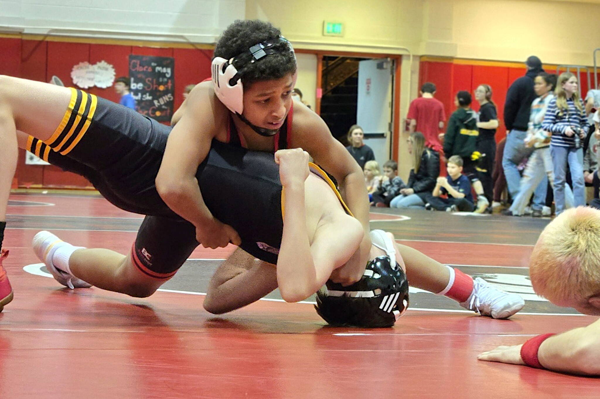 Thunder Mountain Middle School grappler Momar Diouf wrestles an opponent from Thorne Bay during the Stikine Wrestling Championships last weekend in Wrangell. (Photo courtesy TMMS)