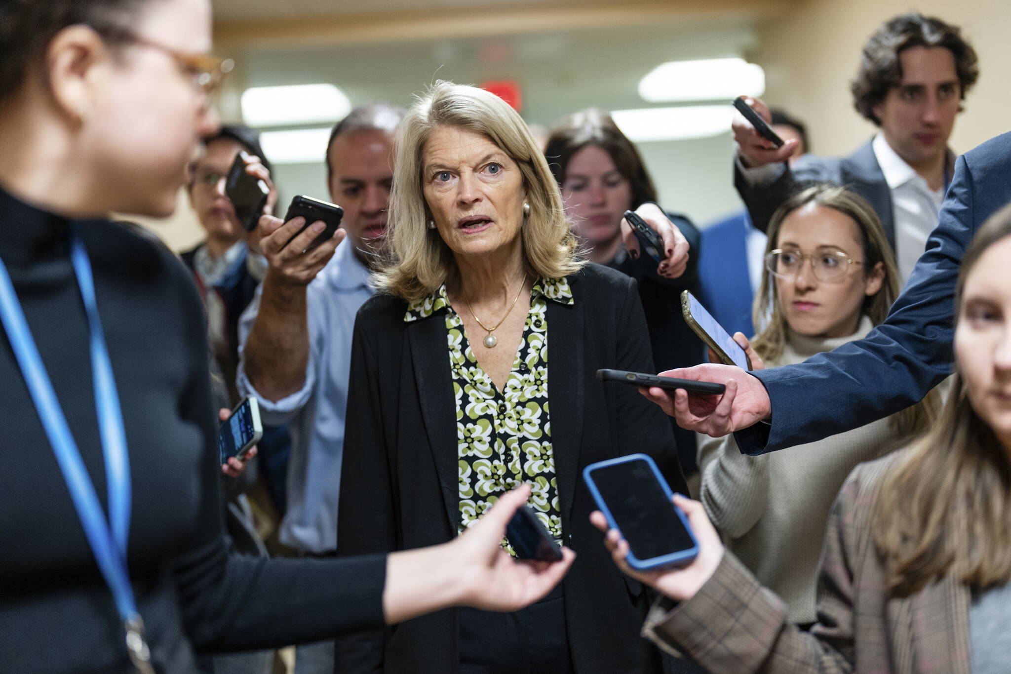 Sen. Lisa Murkowski (R-Alaska) is surrounded by reporters as she arrives on the Senate Subway to vote on Capitol Hill in Washington, on Tuesday, Jan. 28, 2025. (Eric Lee/The New York Times)