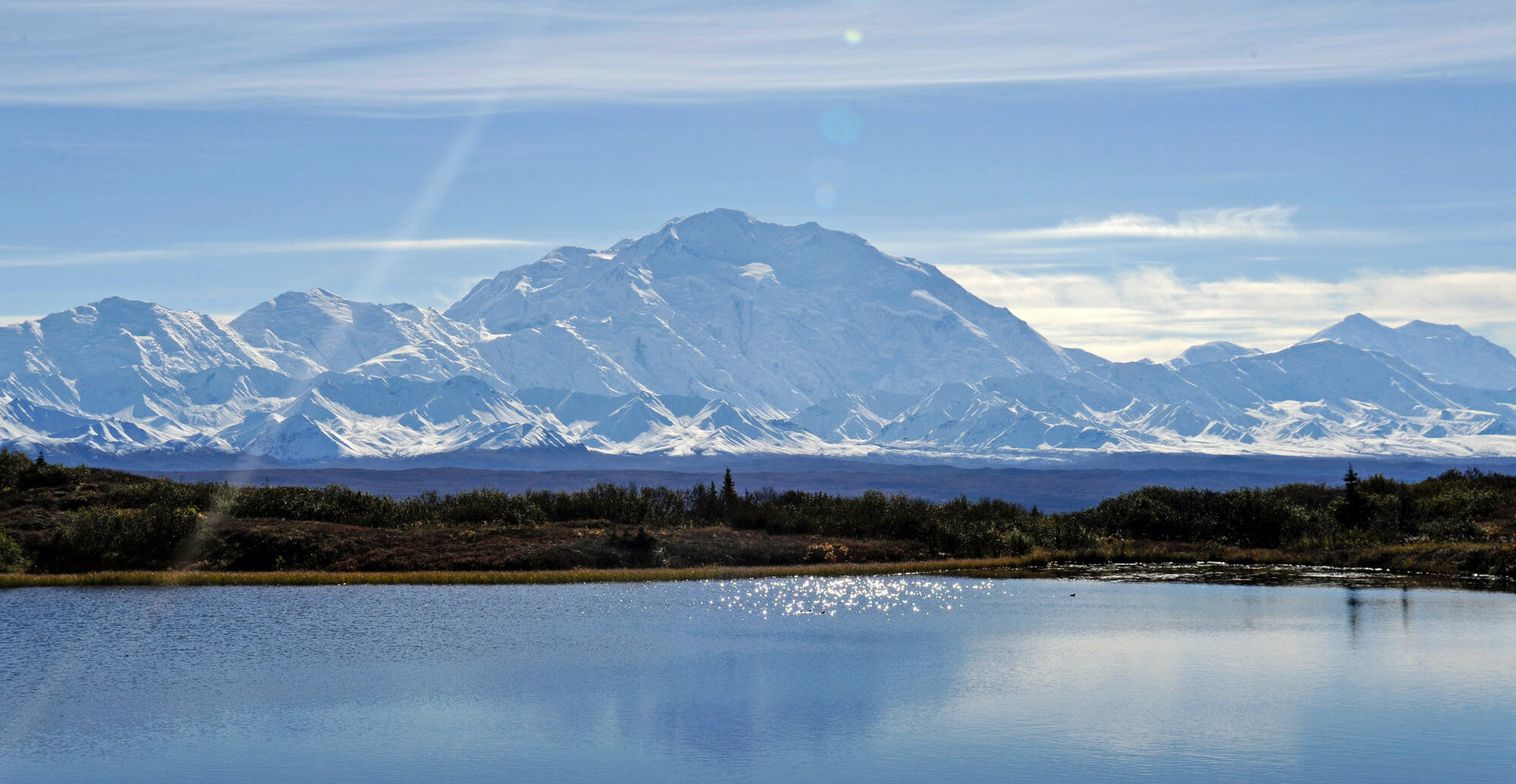 Denali rises in the distance behind Wonder Lake in Denali National Park and Preserve. (Klas Stolpe)