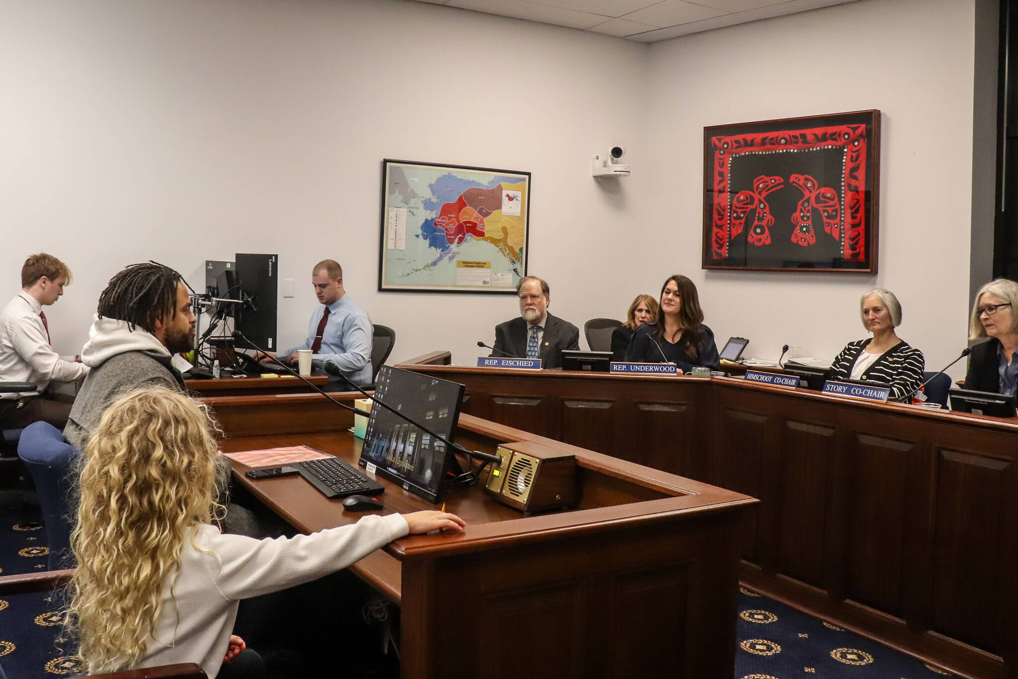 Ephraim Froelich, a Juneau resident, testifies in support of House Bill 69 on Jan. 29, 2025. His son, who attends first grade in the Juneau School District, sits beside him. (Jasz Garrett / Juneau Empire)