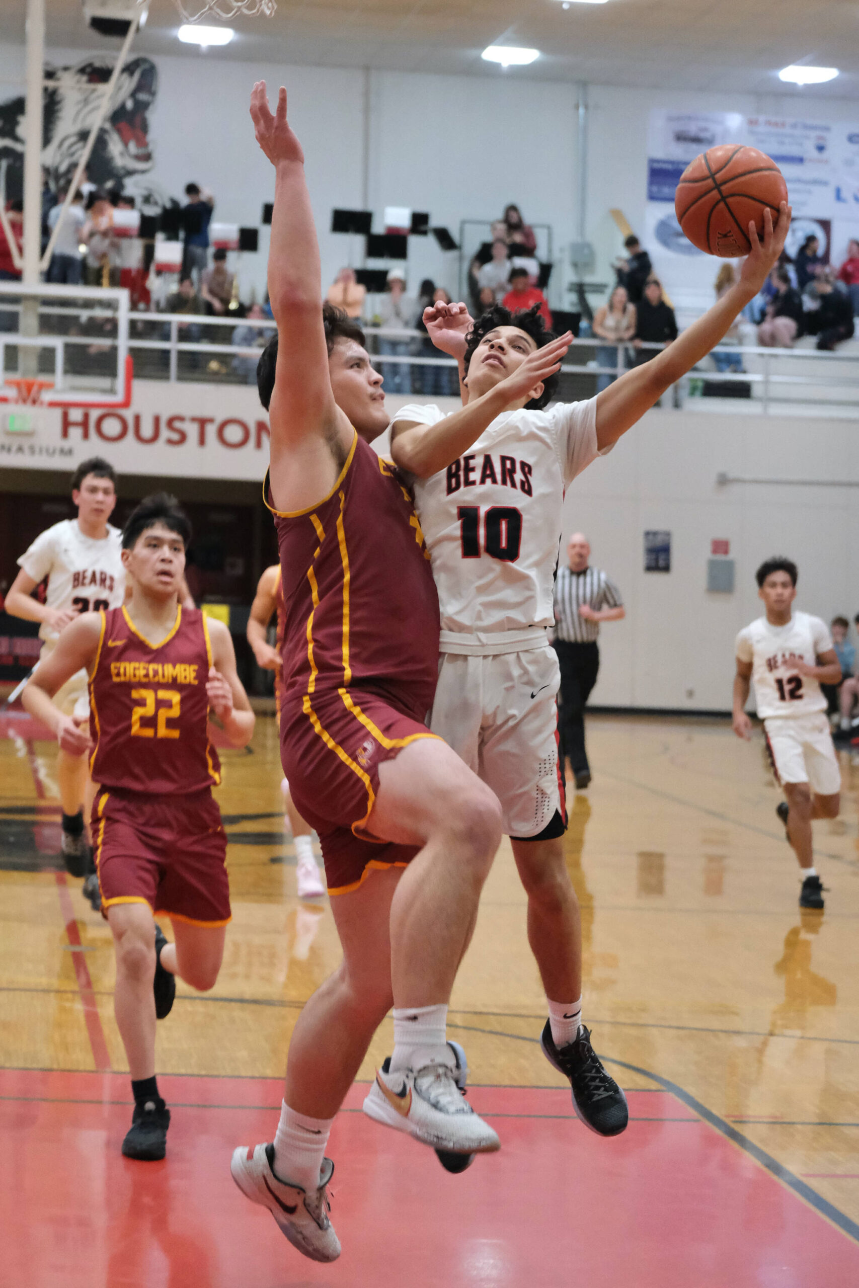 Mt. Edgecumbe senior Donovan Stephen-Standifer defends a shot by Juneau-Douglas High School: Yadaa.at Kalé senior Pedrin Saceda-Hurt during the Braves 80-66 win over the Crimson Bears on Friday in the George Houston Gymnasium. The two teams play again Saturday at 6 p.m. (Klas Stolpe / Juneau Empire)