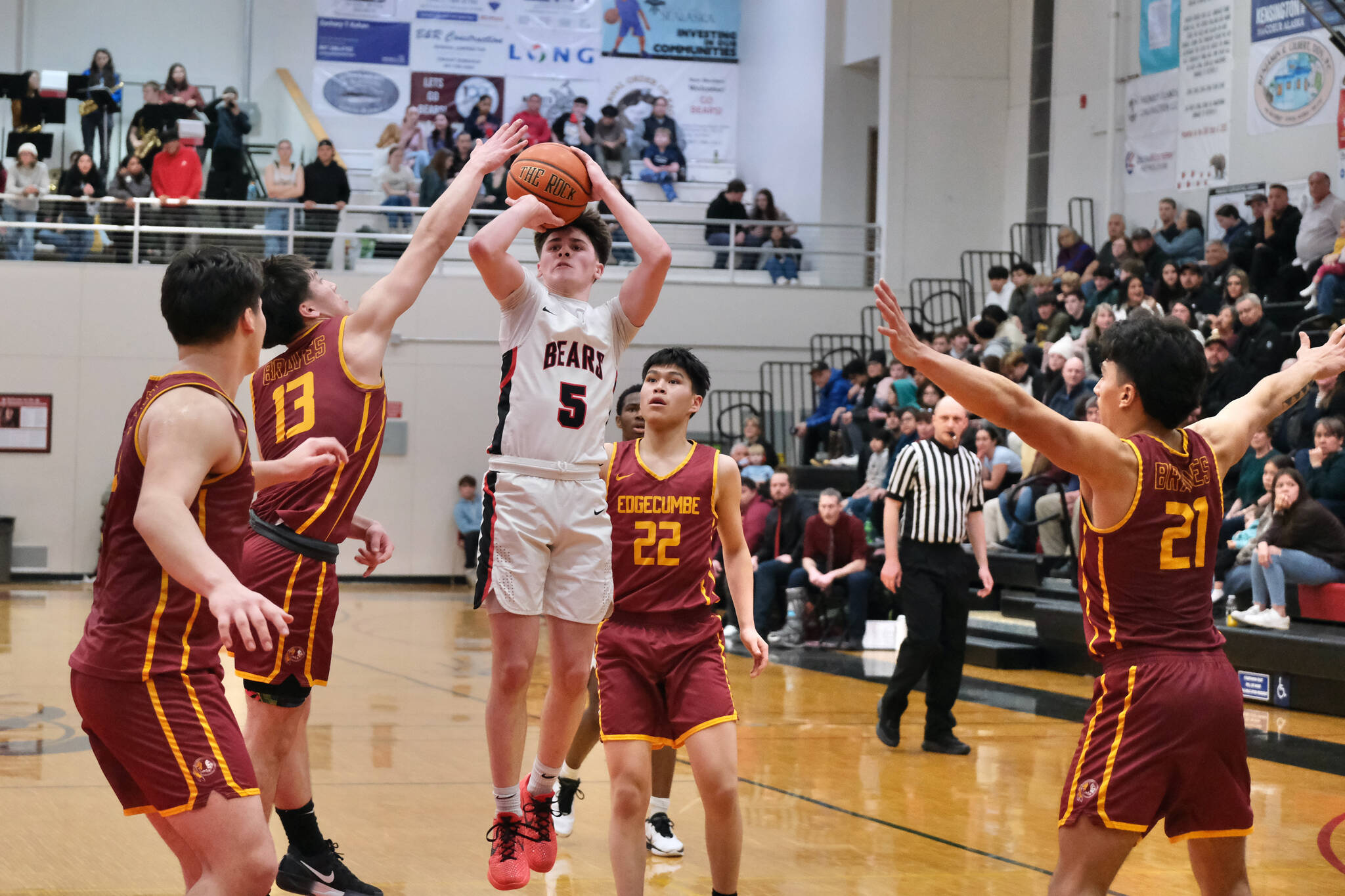 Juneau-Douglas High School: Yadaa.at Kalé junior Brandon Casperson (5) attempts a shot against Mt. Edgecumbe senior Donovan Stephen-Standifer, sophomore Kaden Herrmann (13), sophomore Royce Alstrom and senior Richard Didrickson Jr. (21) during the Crimson Bears 80-66 loss to the Braves on Friday in the George Houston Gymnasium. The two teams play again Saturday at 6 p.m. (Klas Stolpe / Juneau Empire)