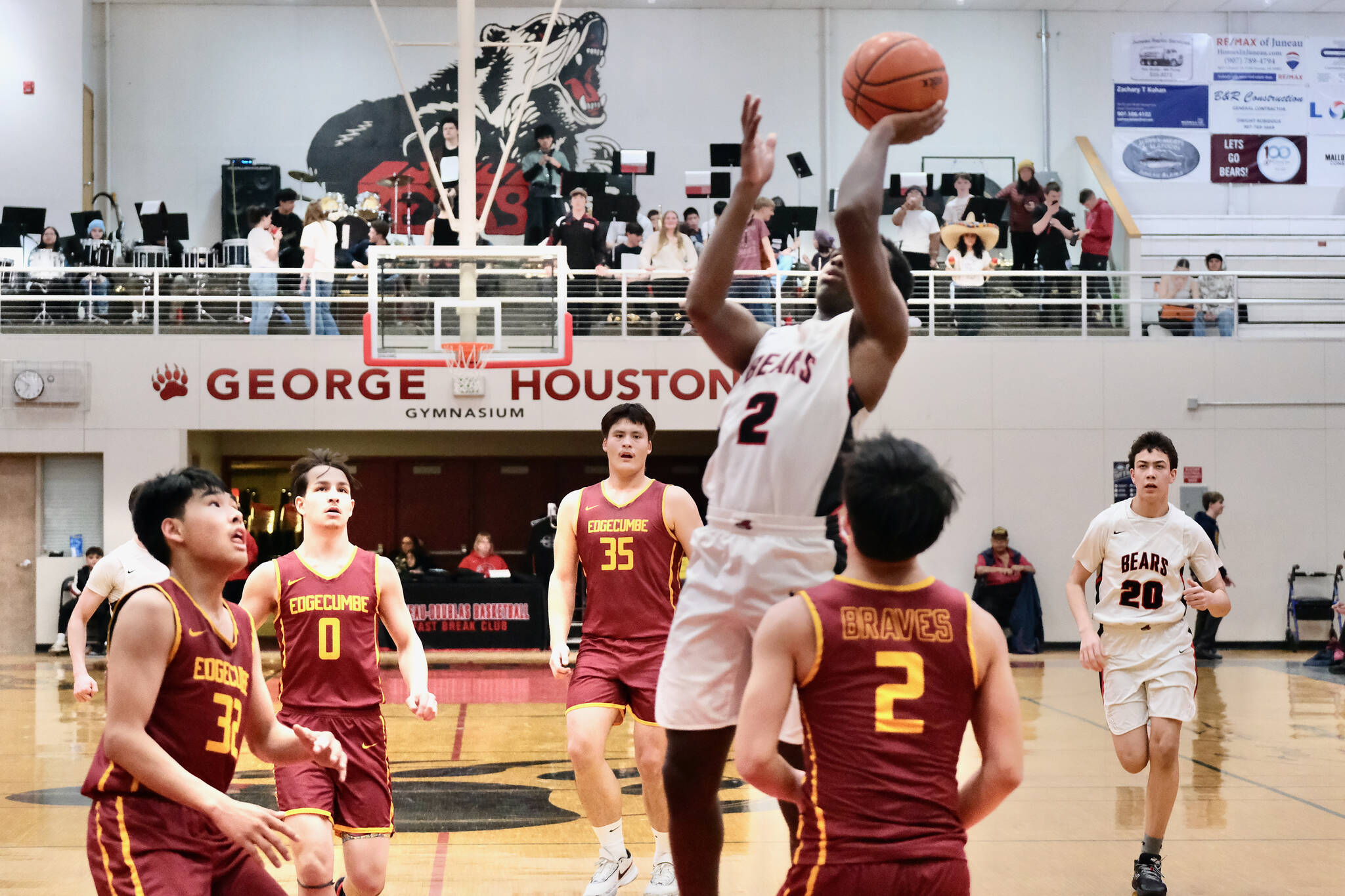 Juneau-Douglas High School: Yadaa.at Kalé senior Ahmir Parker (2) shoots against Mt. Edgecumbe senior Brent Sun (32) Lennie Brandell (0) Donovan Stephen-Standifer (35) and junior Torian Dull (2) during the Crimson Bears’ 68-47 loss to the Braves on Saturday in the George Houston Gymnasium. (Klas Stolpe / Juneau Empire)