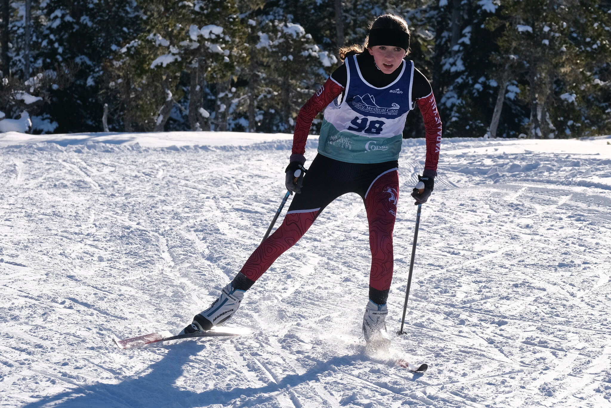 Juneau-Douglas High School: Yadaa.at Kalé Nordic Ski freshman Sunna Schane (98) races during the Shaky Shakeout Invitational six-kilometer freestyle mass start Saturday at Eaglecrest Ski Area. (Klas Stolpe / Juneau Empire)