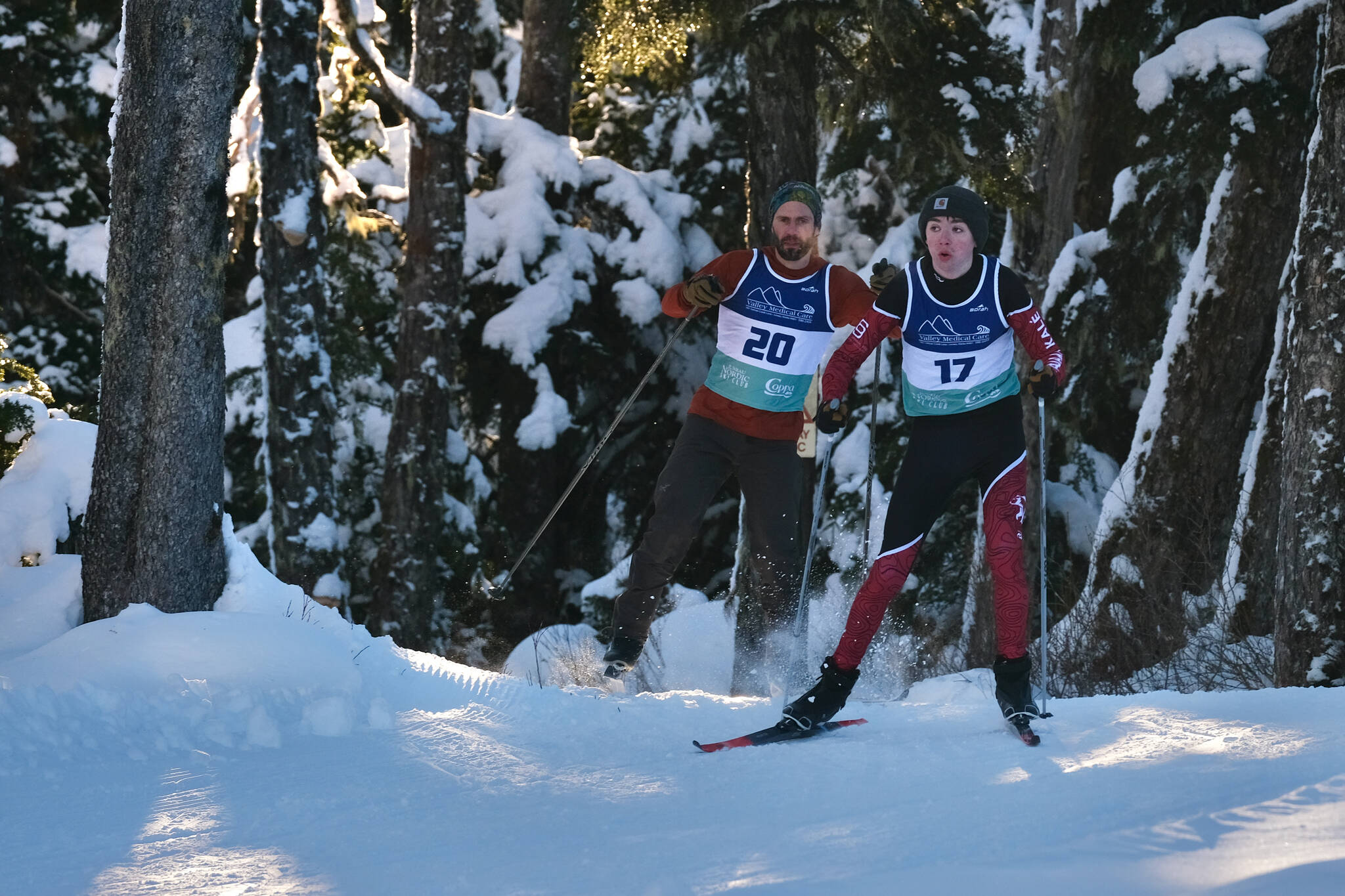 Juneau-Douglas High School: Yadaa.at Kalé Nordic Ski Team freshman Landon Adkins (17) leads a community cross-country skier during the Shaky Shakeout Invitational six-kilometer freestyle mass start race Saturday at Eaglecrest Ski Area. (Klas Stolpe / Juneau Empire)