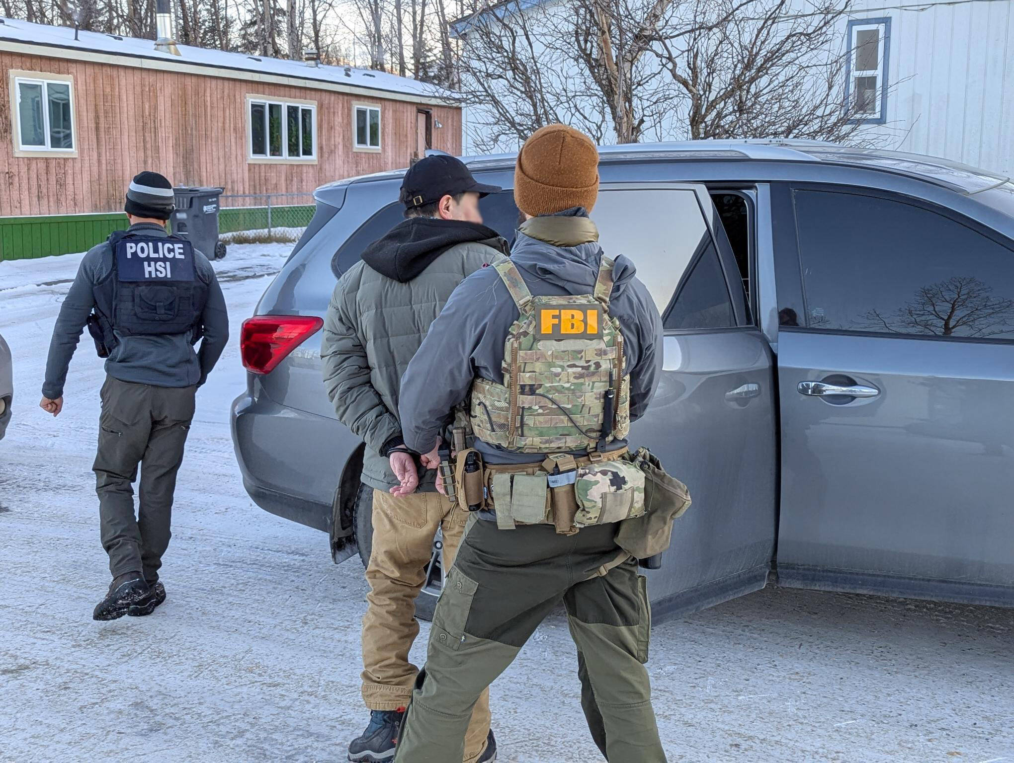 A person is detained in Anchorage in recent days by officials from the FBI and U.S. Department of Homeland Security. (FBI Anchorage Field Office photo)