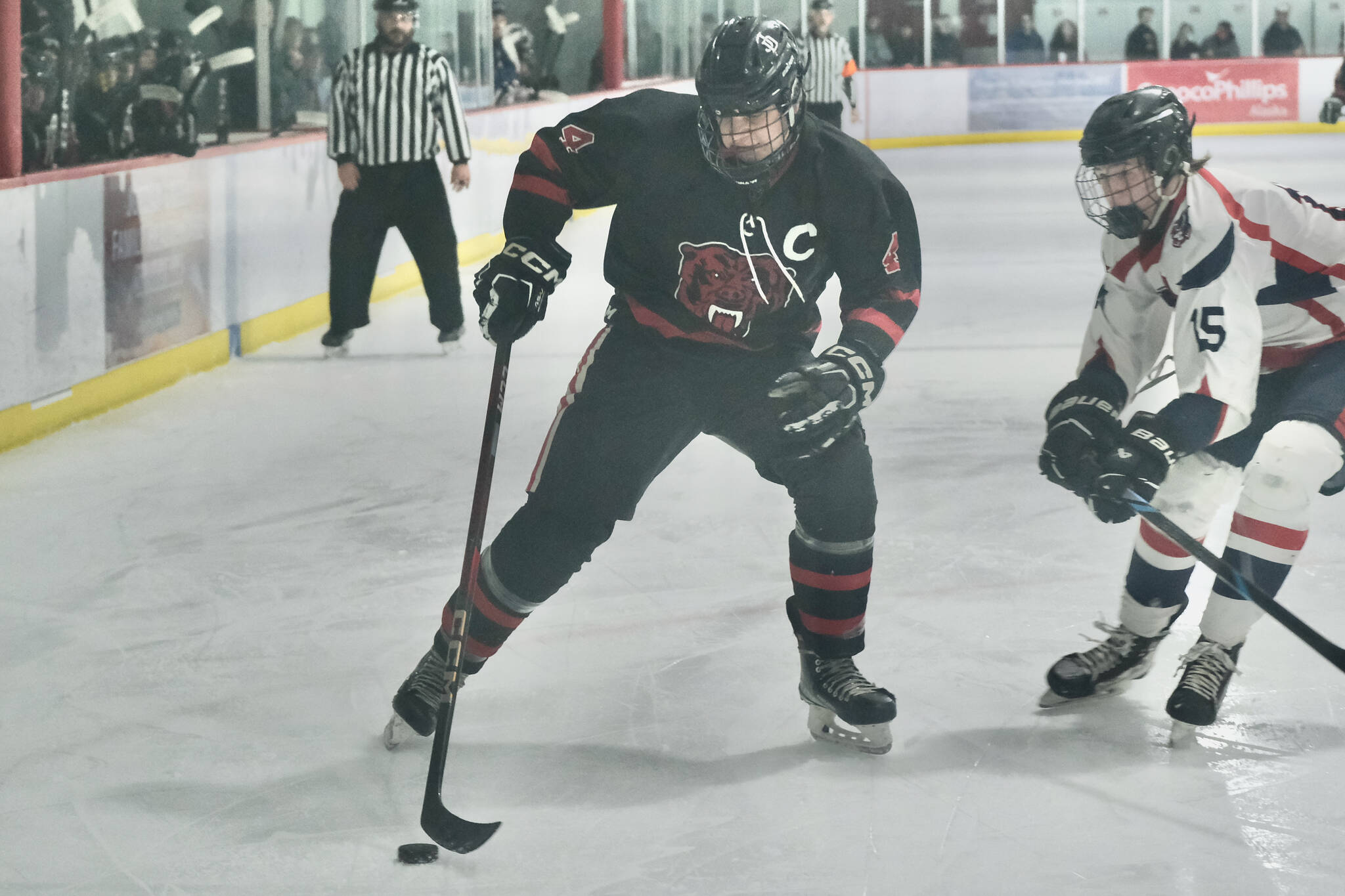 Juneau-Douglas High School: Yadaa.at Kalé Crimson Bears hockey senior captain Luke Bovitz (4) was selected to the 2025 Northern Lights All-Conference Team this week at the ASAA state hockey tournament. (Klas Stolpe / Juneau Empire)