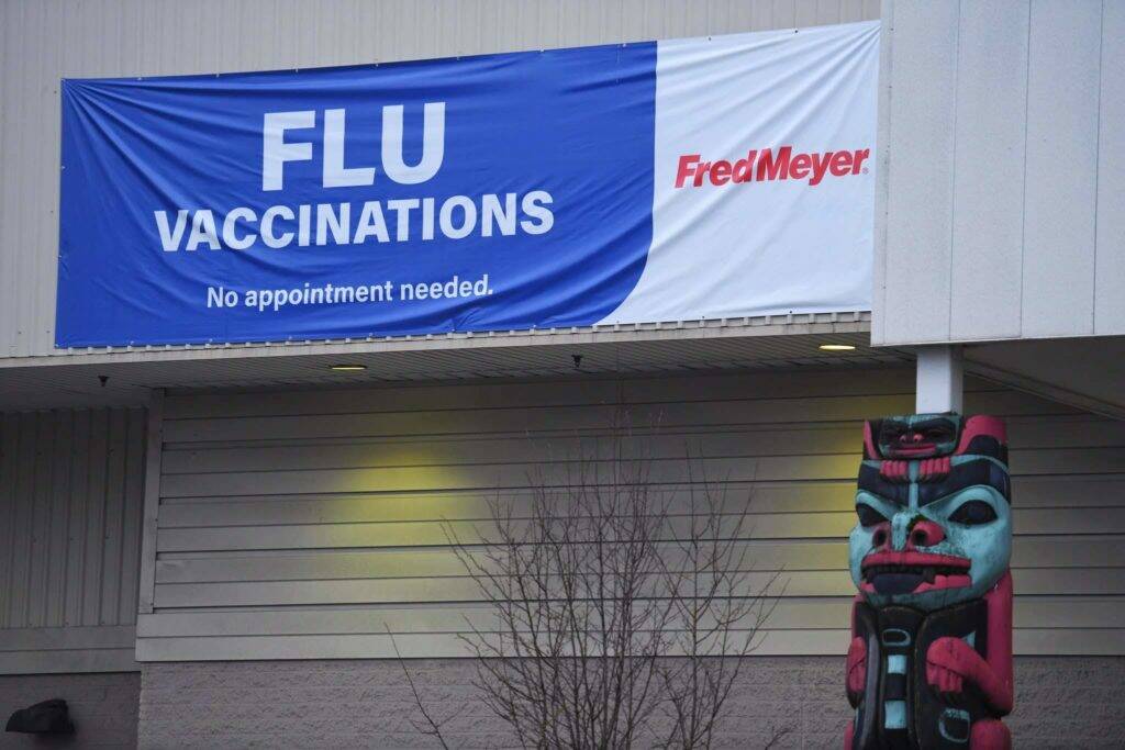 Fred Meyer advertises flu vaccinations via a banner outside its pharmacy on Wednesday, Dec. 11, 2019. (Michael Penn / Juneau Empire file photo)