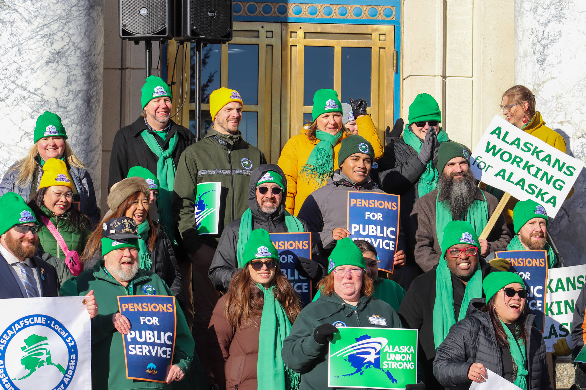 Members of the Alaska State Employees Association and AFSCME Local 52 holds a protest on the steps of the Alaska State Capitol on Friday, Feb. 14, 2025. (Jasz Garrett / Juneau Empire)