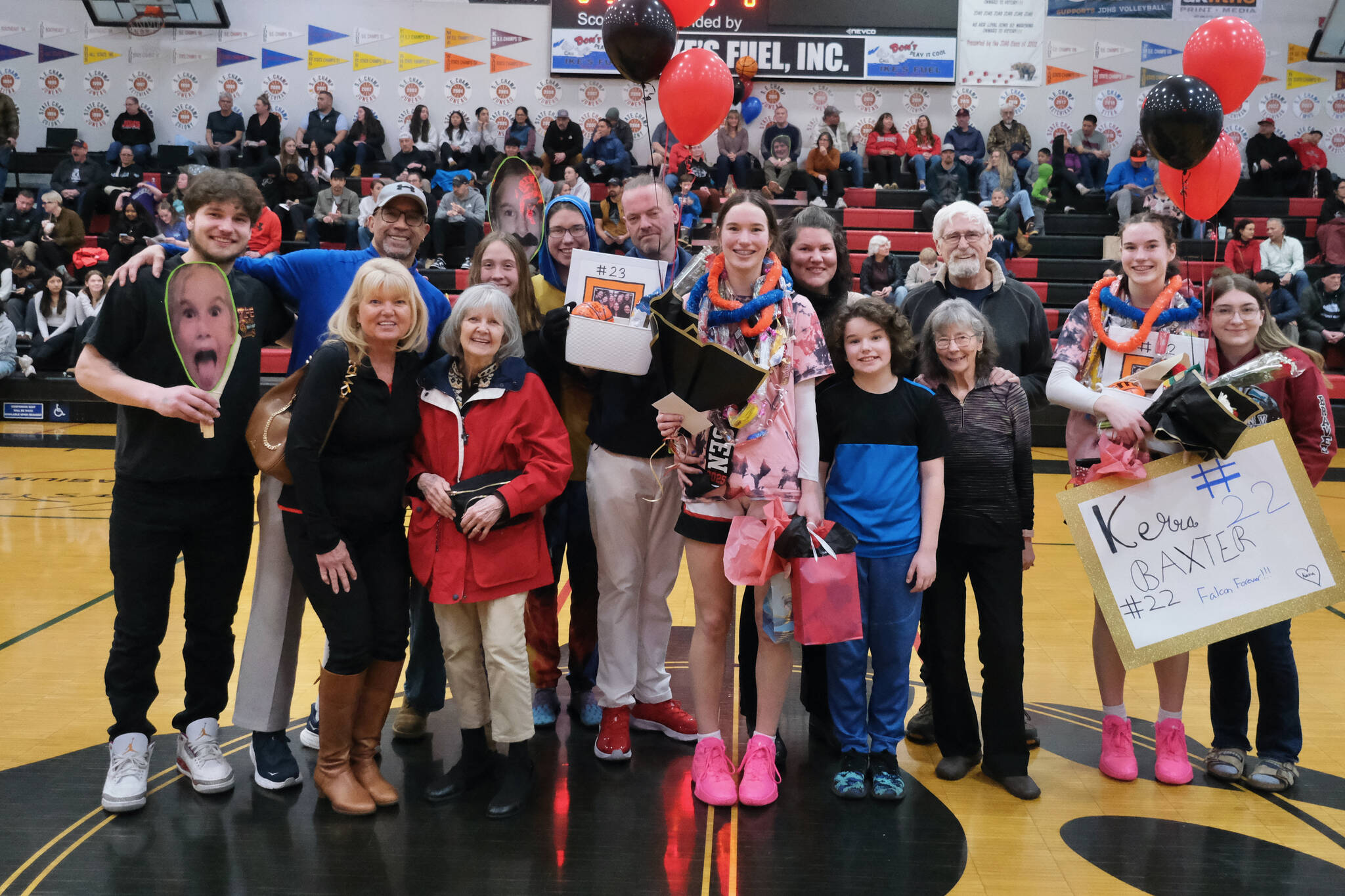 Friends and family of Juneau-Douglas High School: Yadaa.at Kalé Crimson Bears seniors Cailynn and Kerra Baxter during Senior Night honors Saturday at the George Houston Gymnasium. (Klas Stolpe / Juneau Empire)