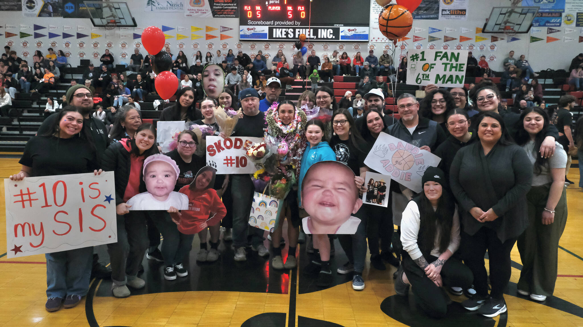 Friends and family of Juneau-Douglas High School: Yadaa.at Kalé Crimson Bears senior Addison Wilson during Senior Night honors Saturday at the George Houston Gymnasium. (Klas Stolpe / Juneau Empire)