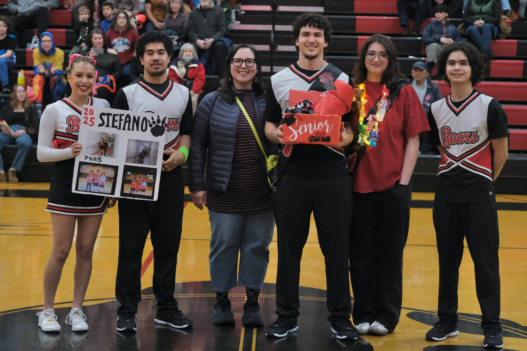 Friends and family of Juneau-Douglas High School: Yadaa.at Kalé Crimson Bears senior Stefano Rivera during Senior Night honors Saturday at the George Houston Gymnasium. (Klas Stolpe / Juneau Empire)