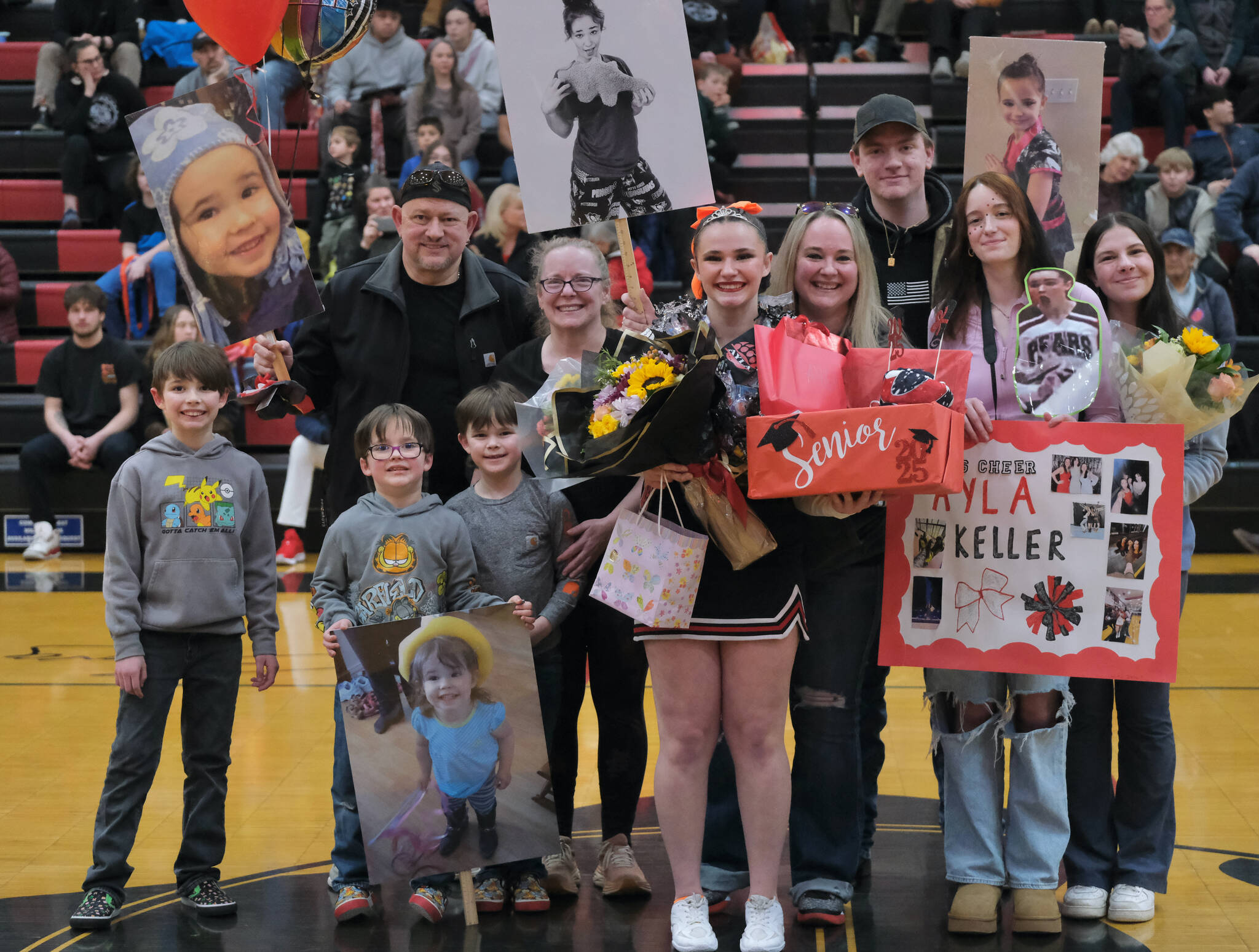 Friends and family of Juneau-Douglas High School: Yadaa.at Kalé Crimson Bears senior Ayla Keller during Senior Night honors Saturday at the George Houston Gymnasium. (Klas Stolpe / Juneau Empire)