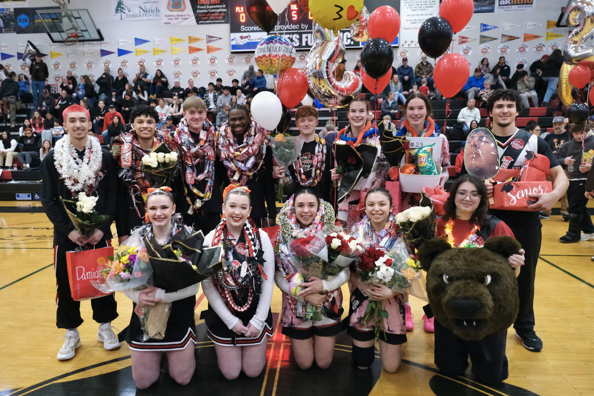 Juneau-Douglas High School: Yadaa.at Kalé senior basketball and cheer members Saturday at George Houston Gymnasium. Back row left-to-right are Damian Efergan, Pedrin Saceda-Hurt, Ben Sikes, Ahmire Parker, Gavin Gerrin, Kerra Baxter, Cailynn Baxter and Stefano Rivera. Front l-r are Ayla Keller, Gabby Ely, Addison Wilson, Mary Johnson and Sophia Percy. (Klas Stolpe / Juneau Empire)