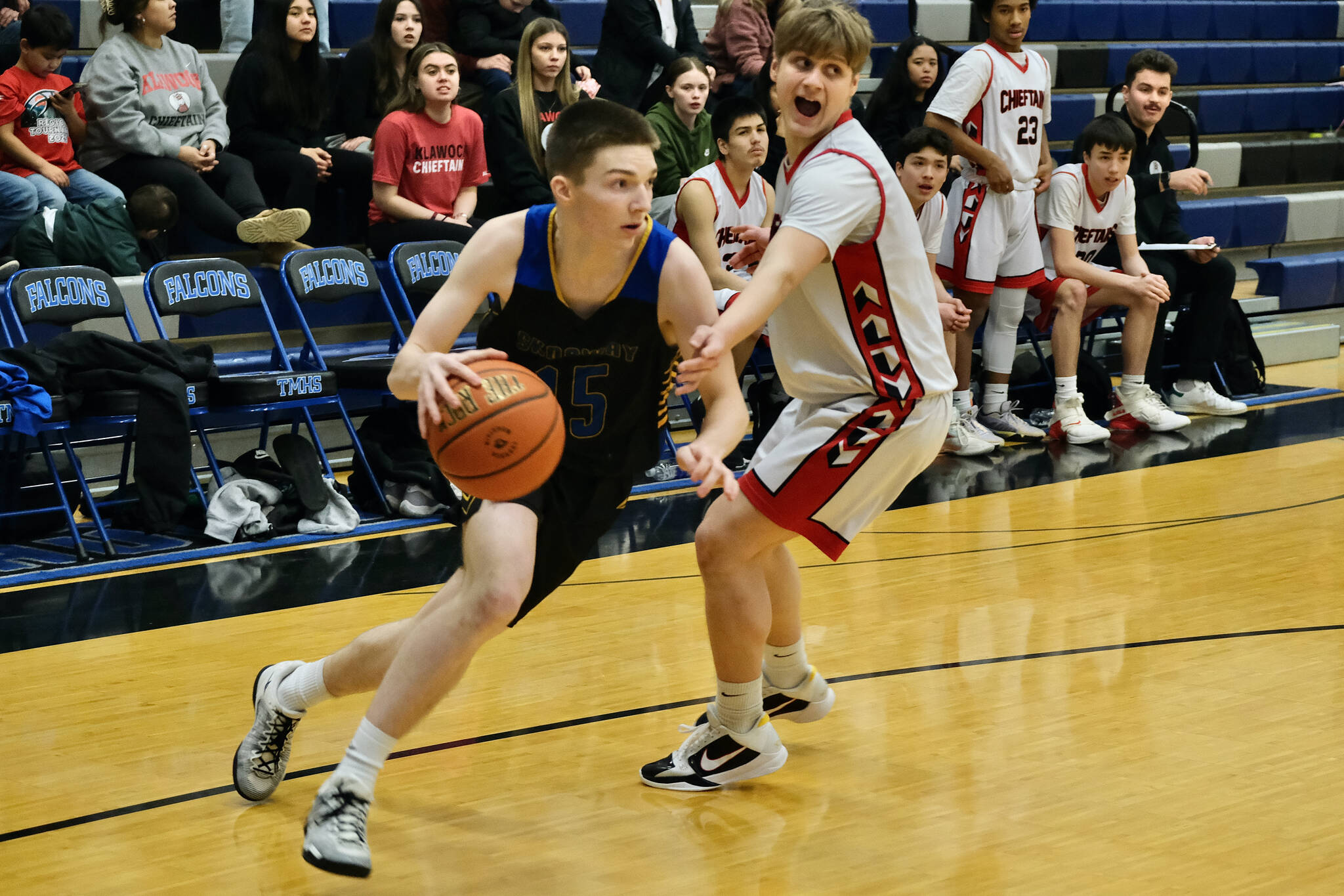 Skagway junior Camden Lawson (15) dribbles past Klawock sophomore Tristin Ryno (1) in the Panthers 53-49 win over the Chieftains on Saturday in the Region V 1A tournament runner-up game at Thunder Mountain Middle School. The game determined the second berth to the state tournament in Anchorage. Kake won the championship berth to state Friday. (Klas Stolpe / Juneau Empire)