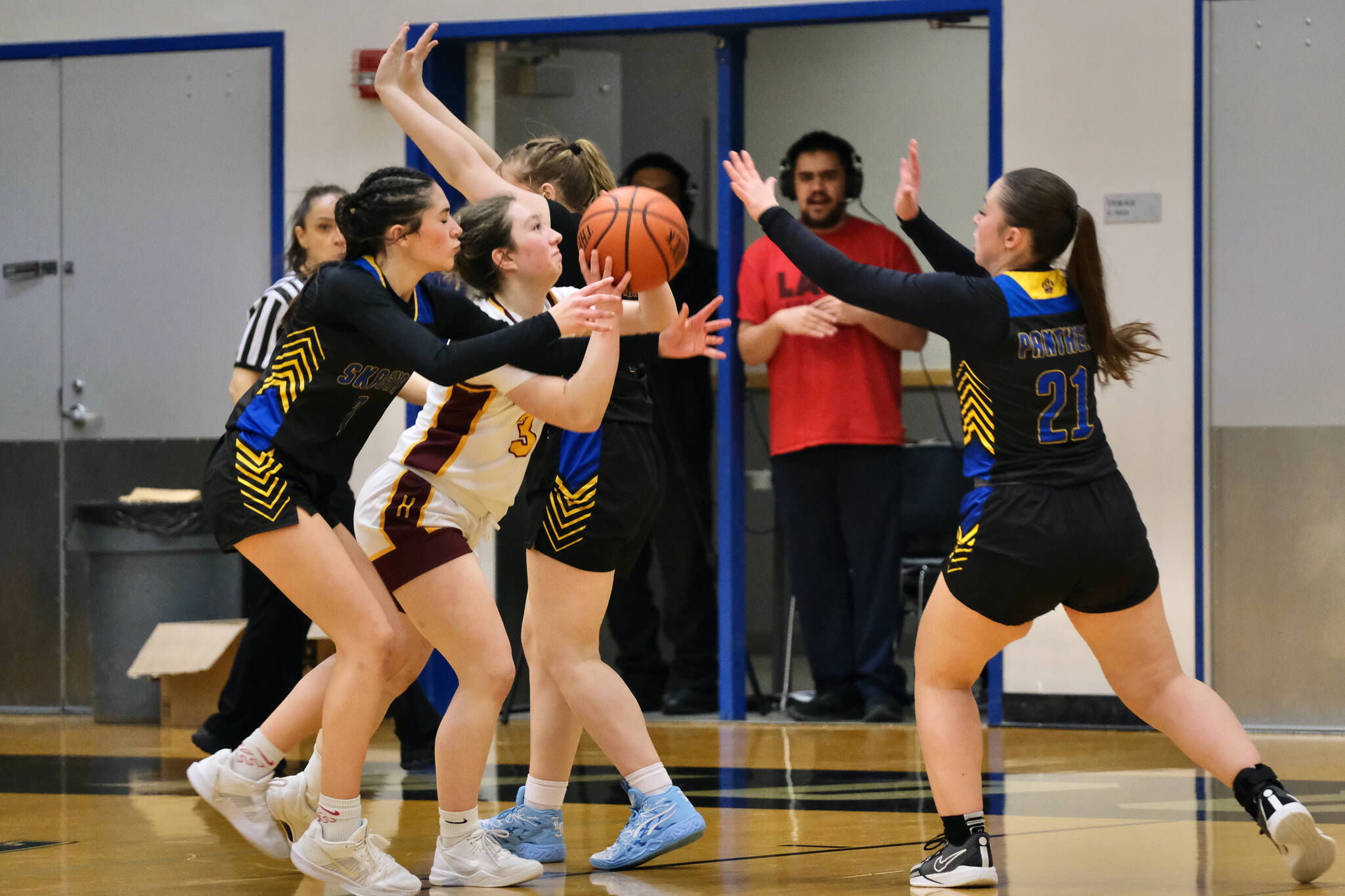 Hoonah’s Jora Savland (3) is swarmed on a shot by Skagway’s Amelia Myers, Kelsey Cox and Lennon Jennings (21) during Saturday’s Region V 1A Girls Basketball Tournament Runner-Up game at Thunder Mountain Middle School. (Klas Stolpe / Juneau Empire)