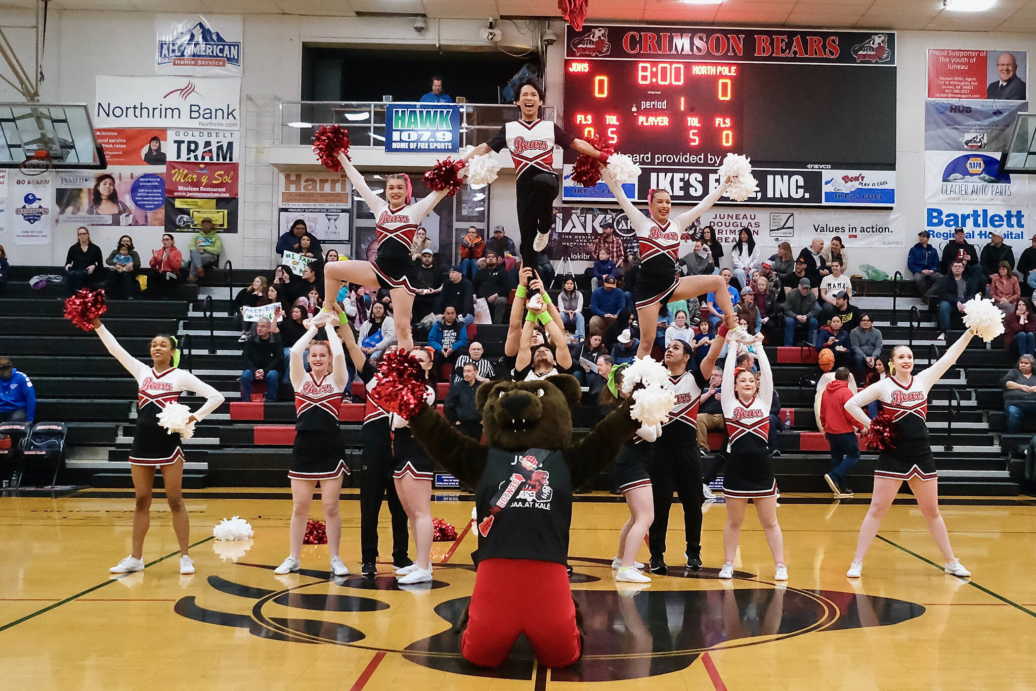 The Juneau-Douglas High School: Yadaa.at Kalé cheer team is shown during last weekend's homecoming series against North Pole. They will be bringing their spirit to the 2A/4A Region V championships in Ketchikan starting Thursday. (Klas Stolpe / Juneau Empire)