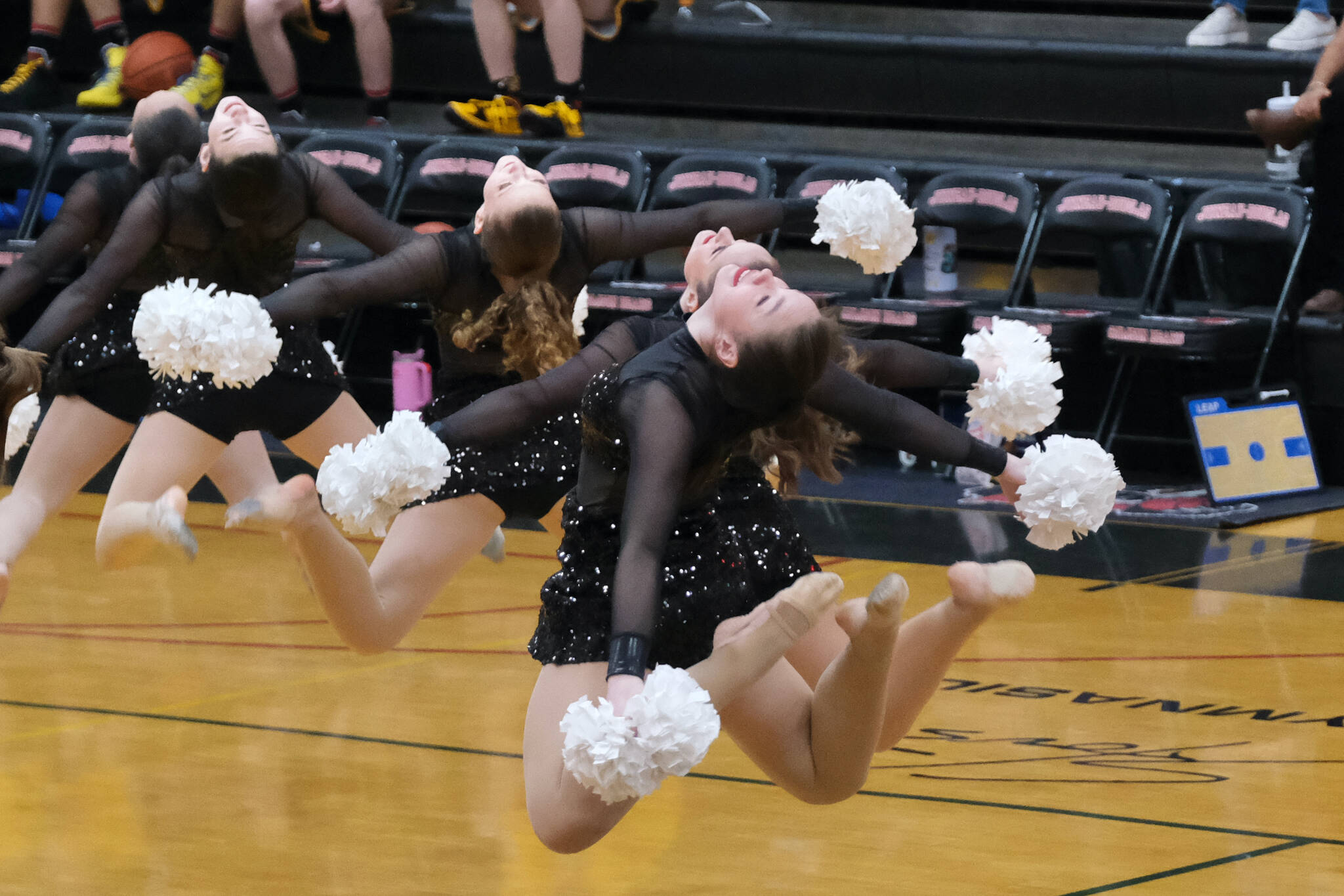 Members of the Juneau-Douglas High School: Yadaa.at Kalé dance team perform their Pom routine during a game this season. The dance team will be performing at the 2A/4A Region V tournament in Ketchikan starting Thursday and being adjudicated Saturday at noon in the Clarke Cochran Gymnasium. (Klas Stolpe / Juneau Empire)