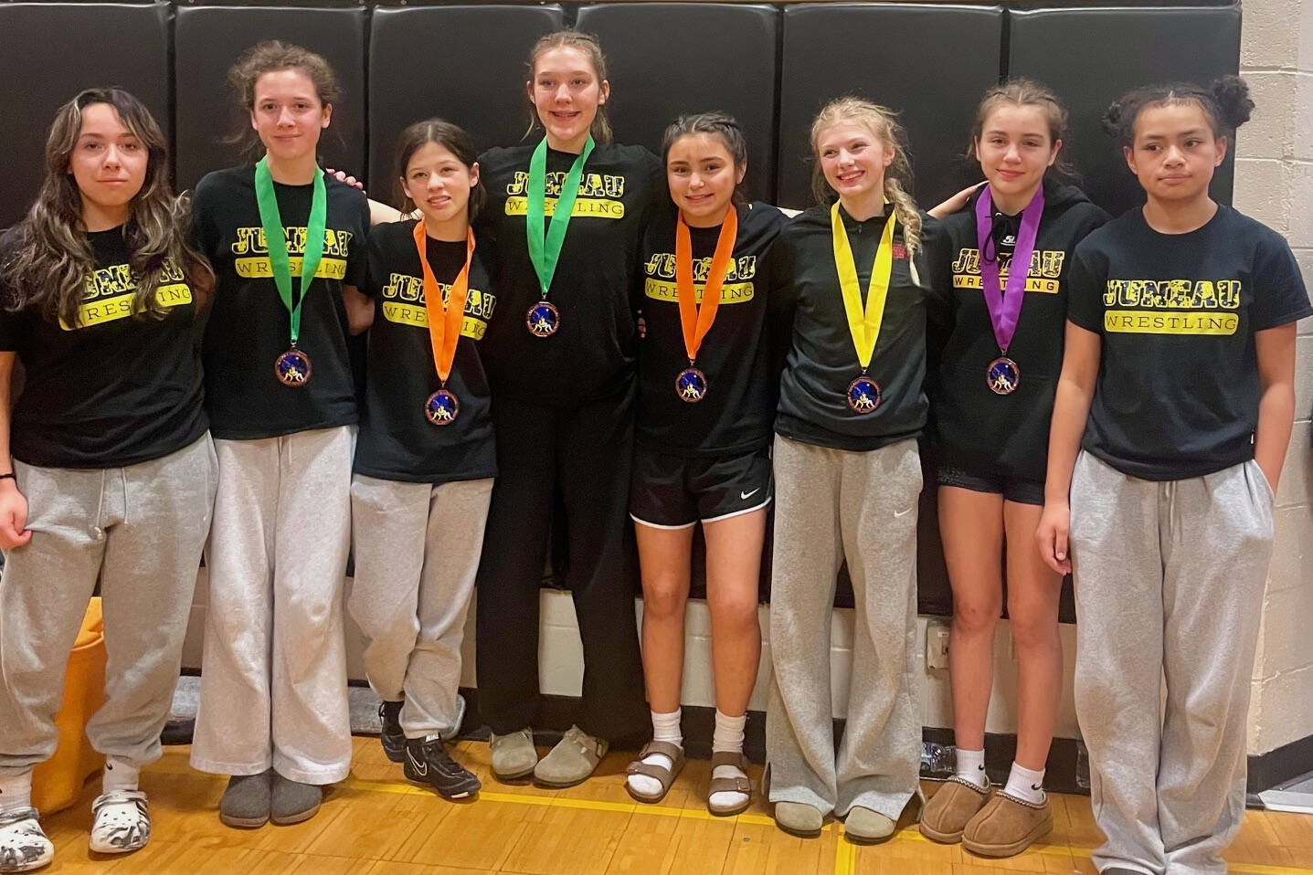 The Juneau Youth Wrestling Club girls division grapplers pose at the Tanana Middle School Wrestling Invitational at Tanana on Saturday. (Photo courtesy JYWC)