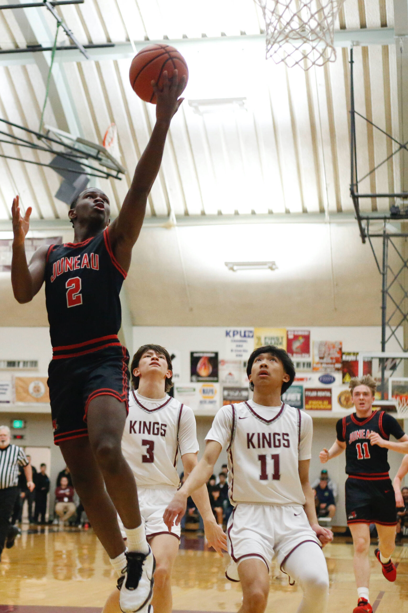 Juneau-Douglas High School: Yadaa.at Kalé’s Amir Parker makes a layup during JDHS’ 56-43 loss to Ketchikan on the first day of the Region V 4A Basketball Tournament at the Clarke Cochrane Gymnasium on Thursday. (Christopher Mullen/ Ketchikan Daily News)