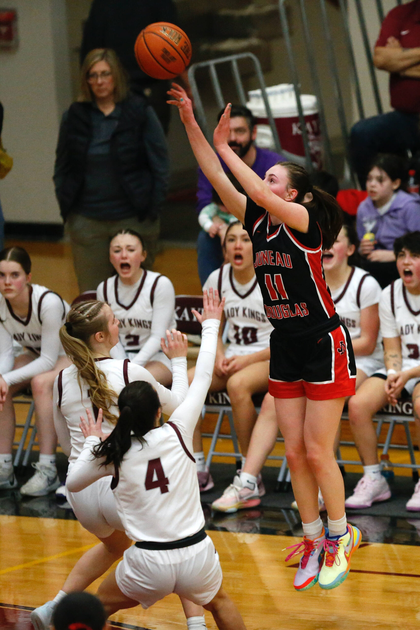 Juneau-Douglas High School: Yadaa.at Kalé’s Gwen Nizich shoots the ball during Juneau-Douglas’s 65-43 victory over Ketchikan, winning the Region V 4A Basketball Tournament at the Clarke Cochrane Gymnasium on Friday. Juneau-Douglas eliminated Ketchikan and will advance to play at state. (Christopher Mullen / Ketchikan Daily News)