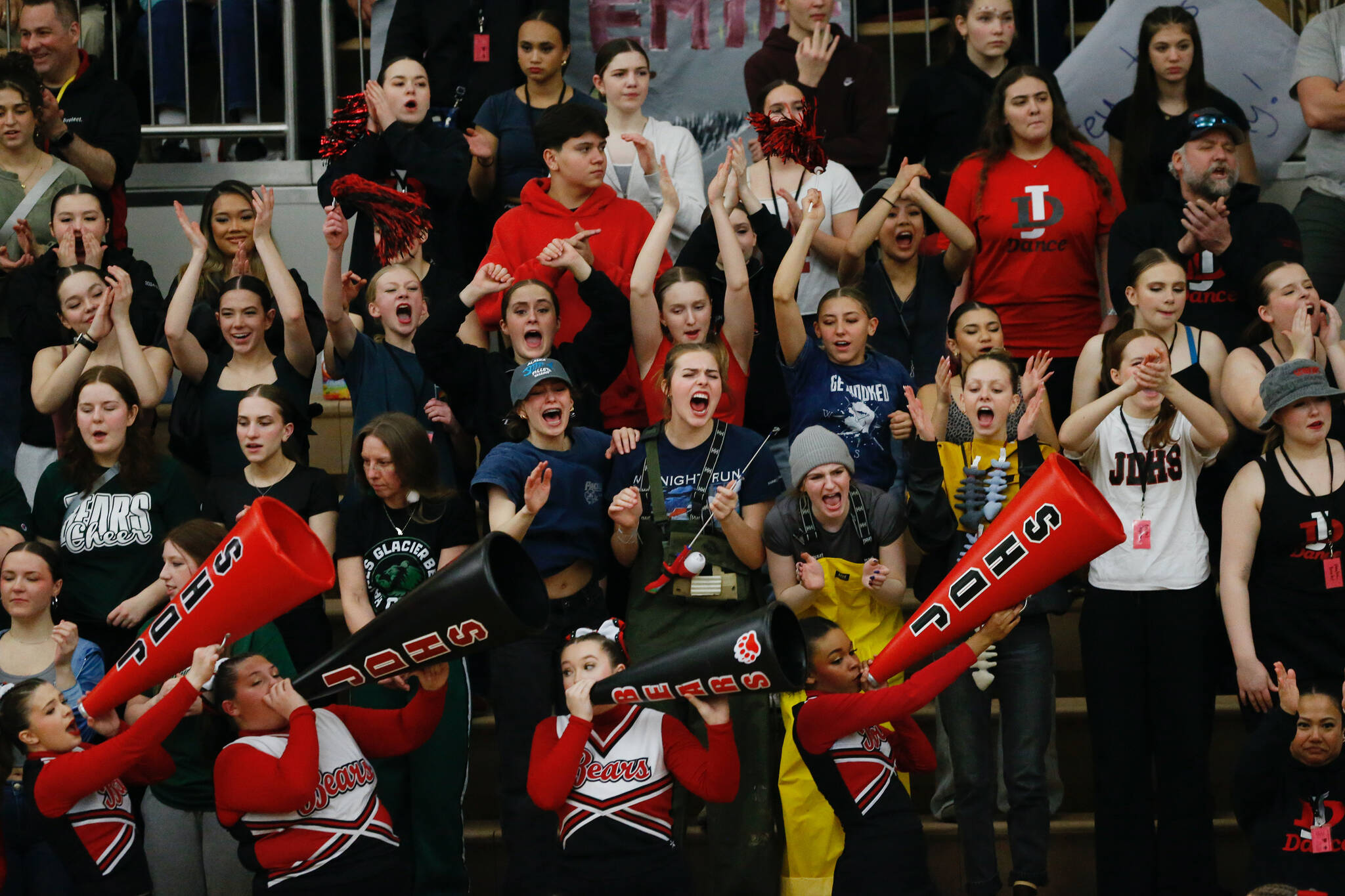 Juneau-Douglas High School: Yadaa.at Kalé’s pep club cheers during Juneau-Douglas’s 65-43 victory over Ketchikan, winning the Region V 4A Basketball Tournament at the Clarke Cochrane Gymnasium on Friday. Juneau-Douglas eliminated Ketchikan and will advance to play at state. (Christopher Mullen / Ketchikan Daily News)