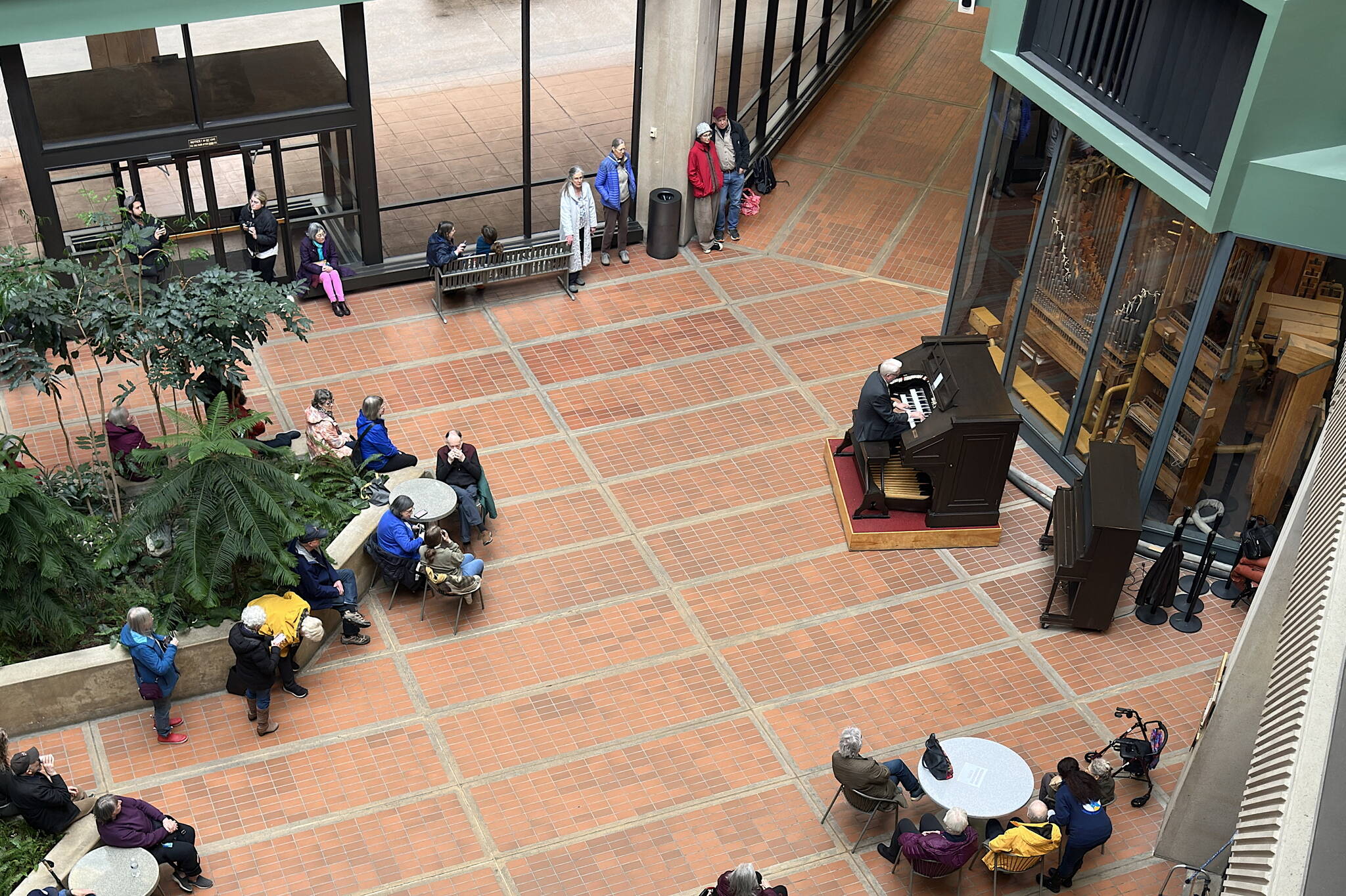 Jonas Nordwall performs a noontime concert on the 1928 Kimball Theatre Pipe Organ at the State Office Building on Friday. Weekly concerts featuring various performers at the instrument draw between 20 to 50 people, according to an official at the Alaska State Museum, which owns the organ. (Mark Sabbatini / Juneau Empire)