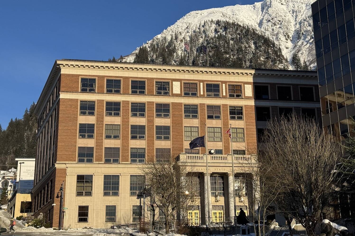 The Alaska State Capitol is seen on Monday, Feb. 3, 2025, in front of snow-covered Mount Juneau. (James Brooks/Alaska Beacon)