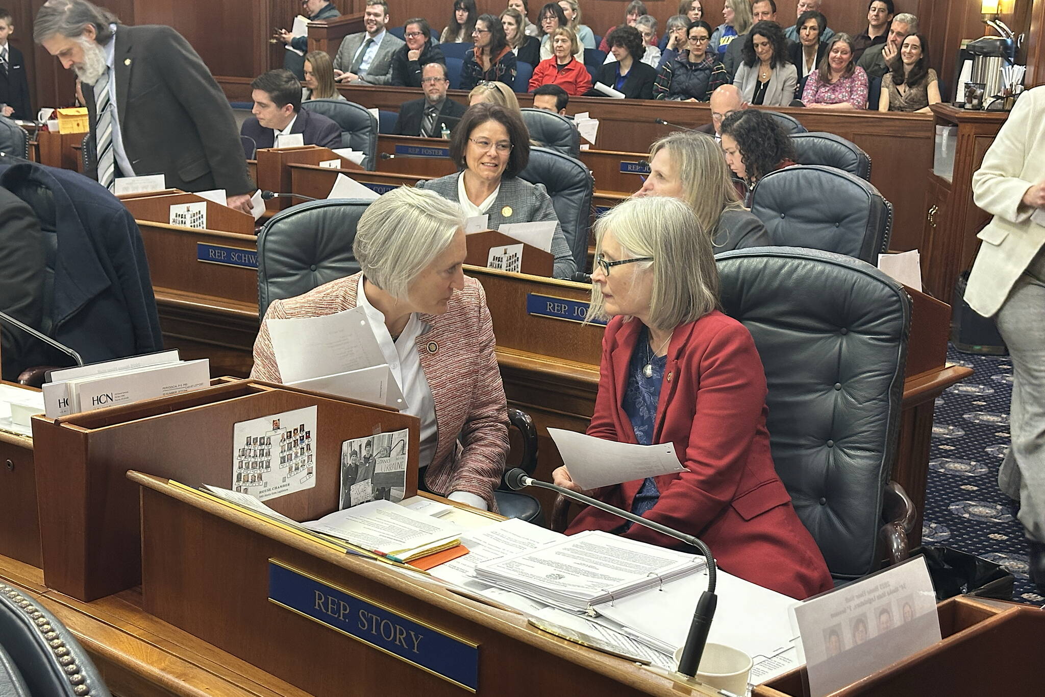 Mark Sabbatini / Juneau Empire
Reps. Rebecca Himschoot (I-Sitka), left, and Andi Story (D-Juneau), who co-chair the House Education Committee, confer during a break in a floor session Monday focusing on an omnibus education bill.