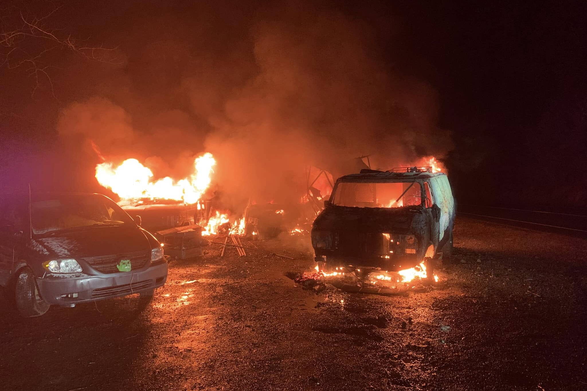 Multiple vehicles are engulfed by fire Monday night at 30 Mile Glacier Highway. (Capital City Fire/Rescue photo)